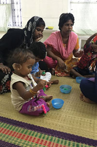 Parents and children participating in Balavidyalaya early intervention program
